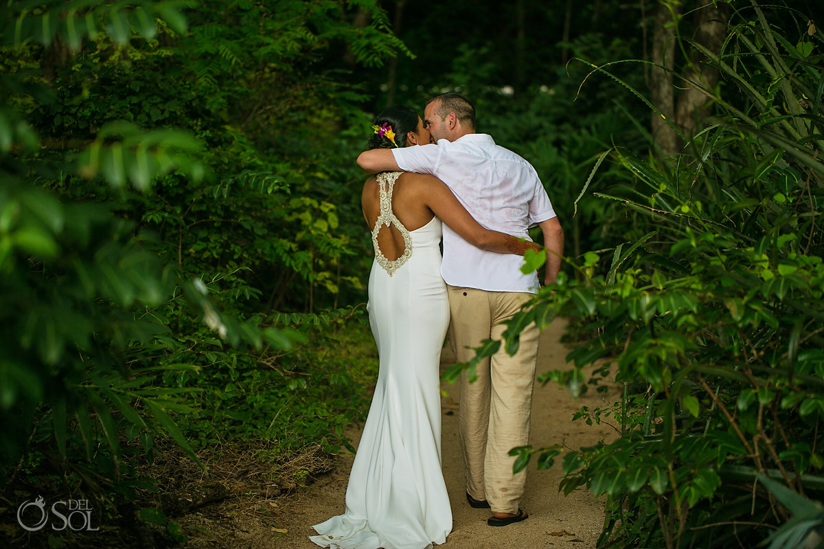 Walking out from the ceremony groom and bride kiss Costa Rica Jungle