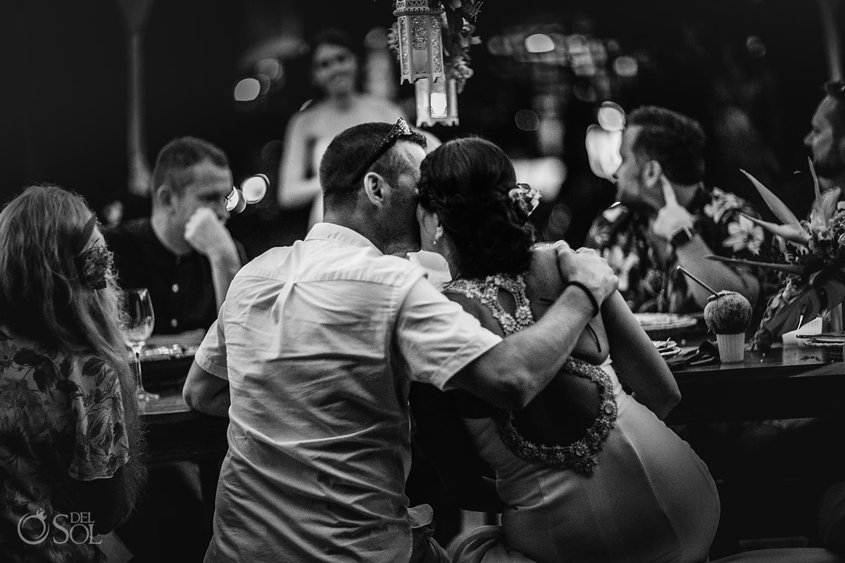 Groom and Bride romantic Kiss at Dinner Reception