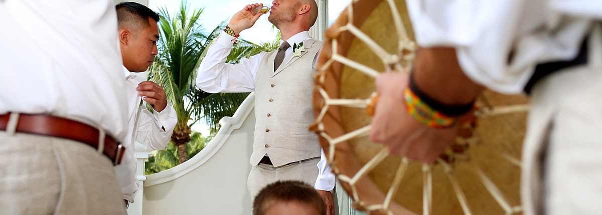 groom performs pre-wedding ceremony by breathing alcohol Dreams Tulum Spiritual Wedding