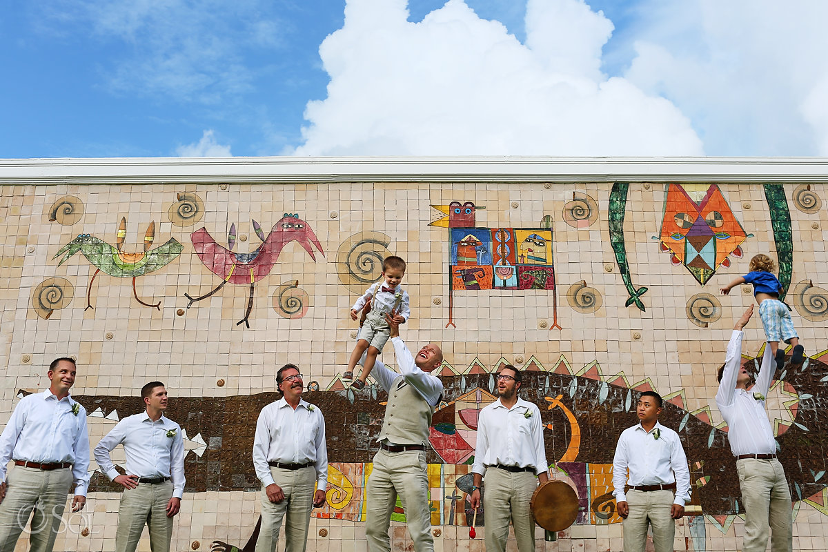 groom groomsmen bridal party portrait colorful wall crocodile mural Dreams Tulum Riviera Maya Mexico