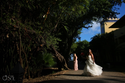 bride spinning in the sunlight on the way to her Iberostar Paraiso del Mar wedding wearing a Matthew Christopher wedding dress