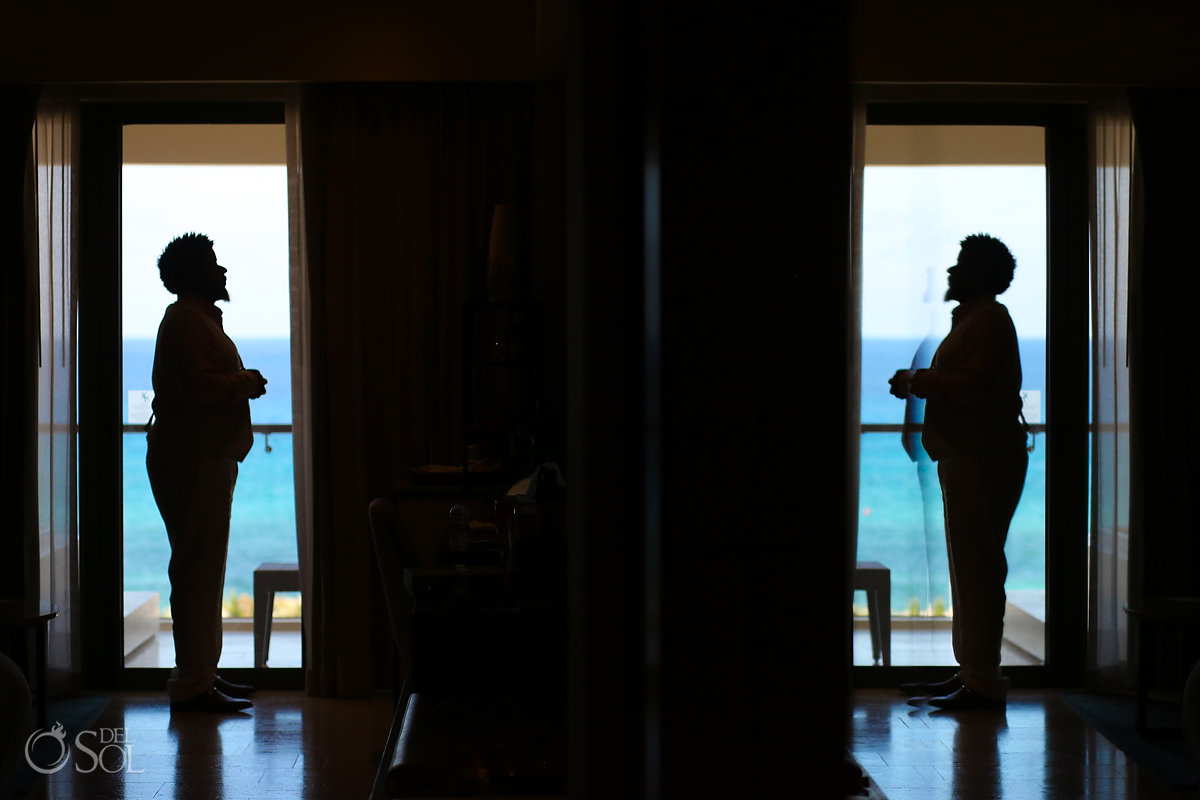groom getting ready silhouette Hyatt Ziva Cancun wedding
