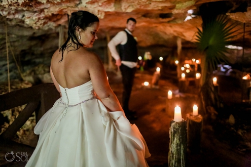 bride walking into candle lit cave cenote trash the dress
