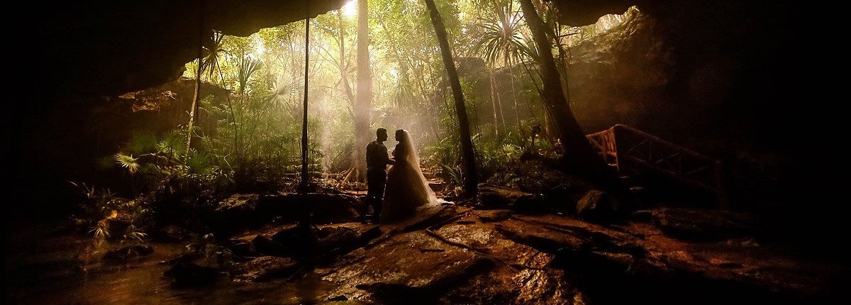 Unique wedding locations bride groom portrait in a cave Riviera Maya Mexico