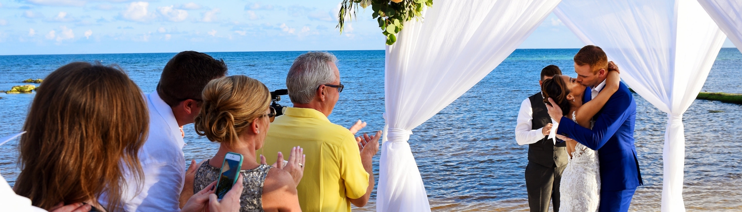 First Kiss newlyweds Beach Front Secrets Silversands Wedding Decoration Ideas family Wedding Cancun