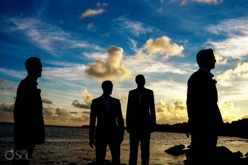 Grooms Party silhouette portrait dramatic sunset sky funny clouds Secrets Silversands Cancun Wedding