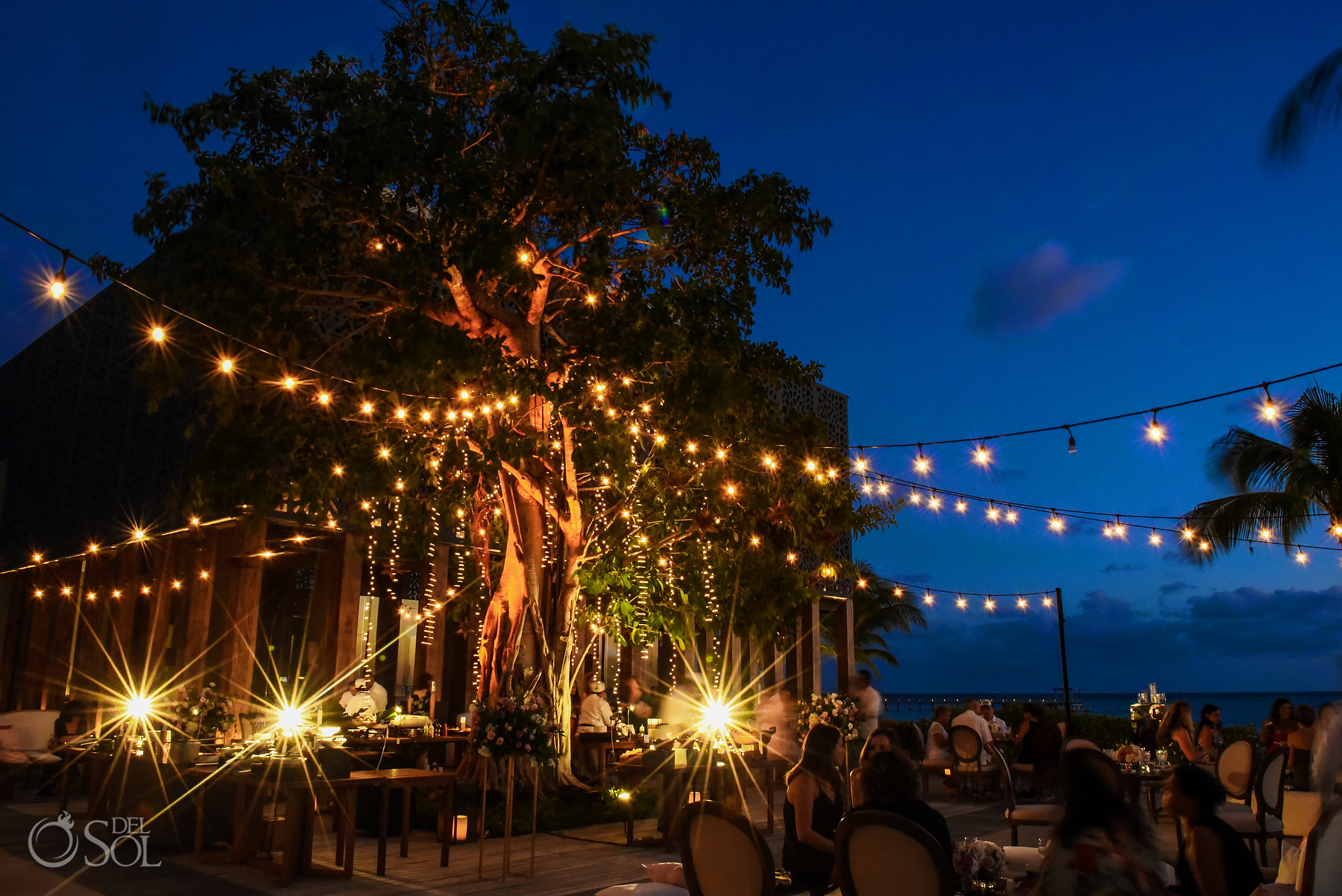 Nizuc Cancun gay wedding reception setup string lights Akan terrace