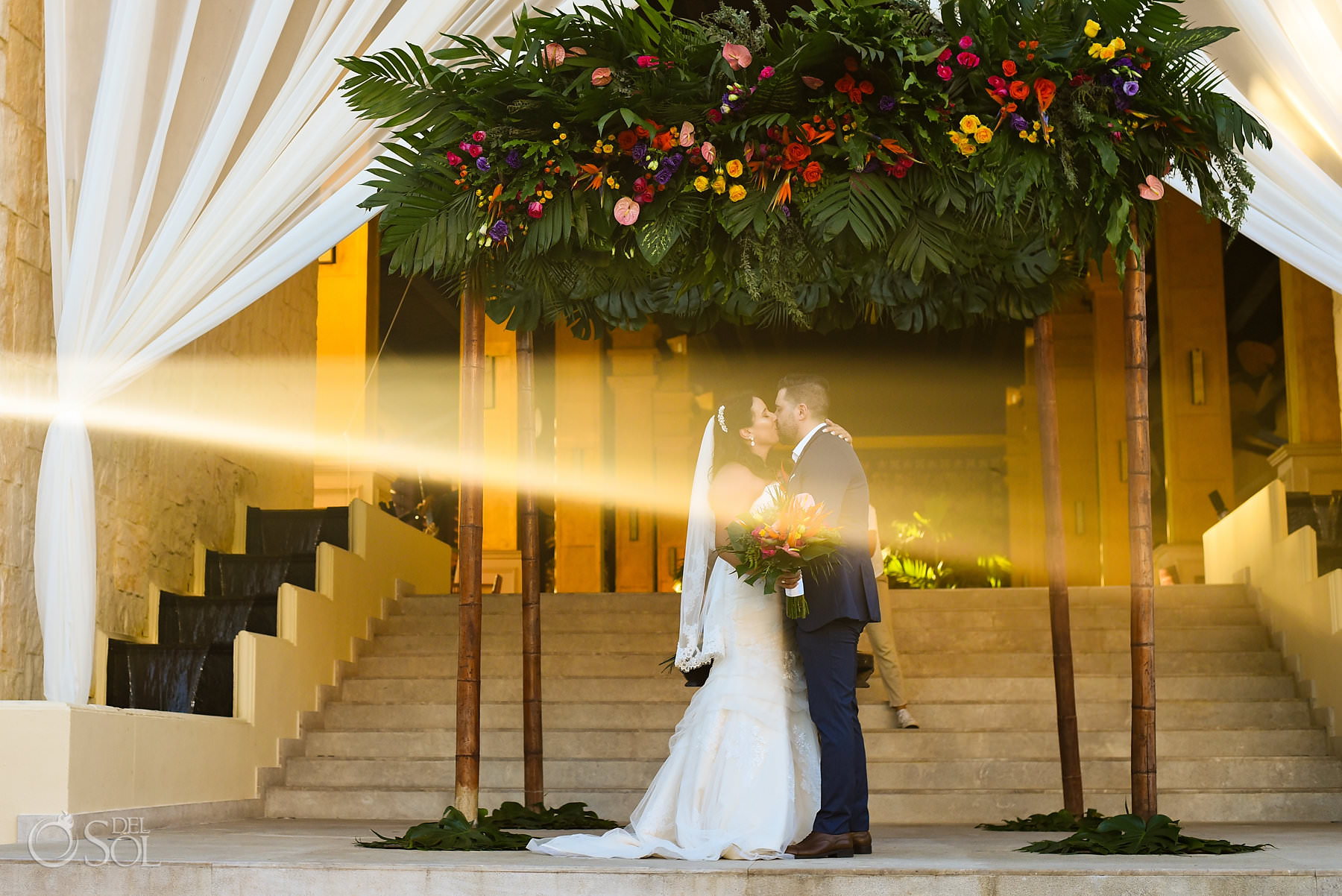 first kiss Dreams Riviera Cancun staircase wedding ceremony