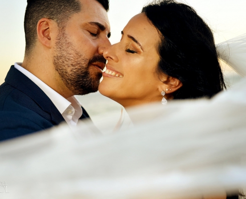Dreams Riviera Cancun wedding kissing bride and groom