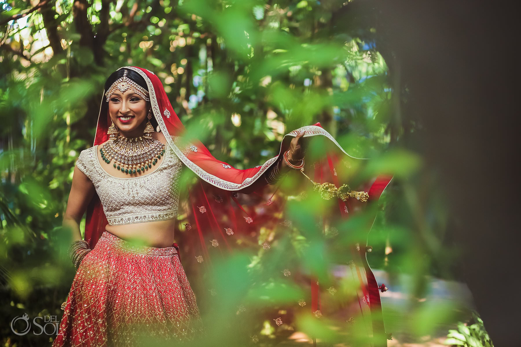 Indian bride wearing red lehenga Dreams Tulum Hin-Jew Wedding Riviera Maya Mexico