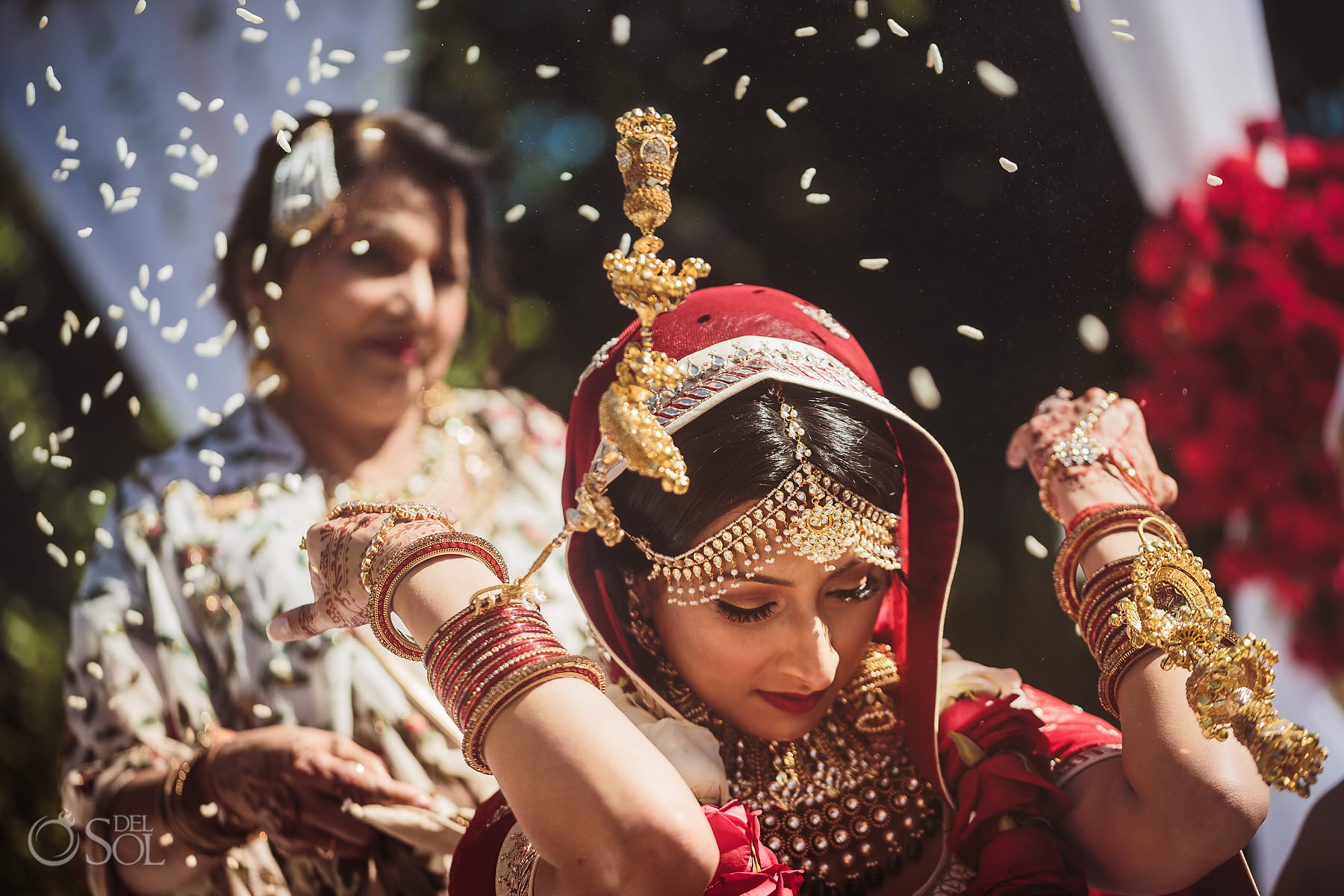 Vidaai Indian bride throwing rice over her head Dreams Tulum Hindu Wedding tradition Riviera Maya Mexico