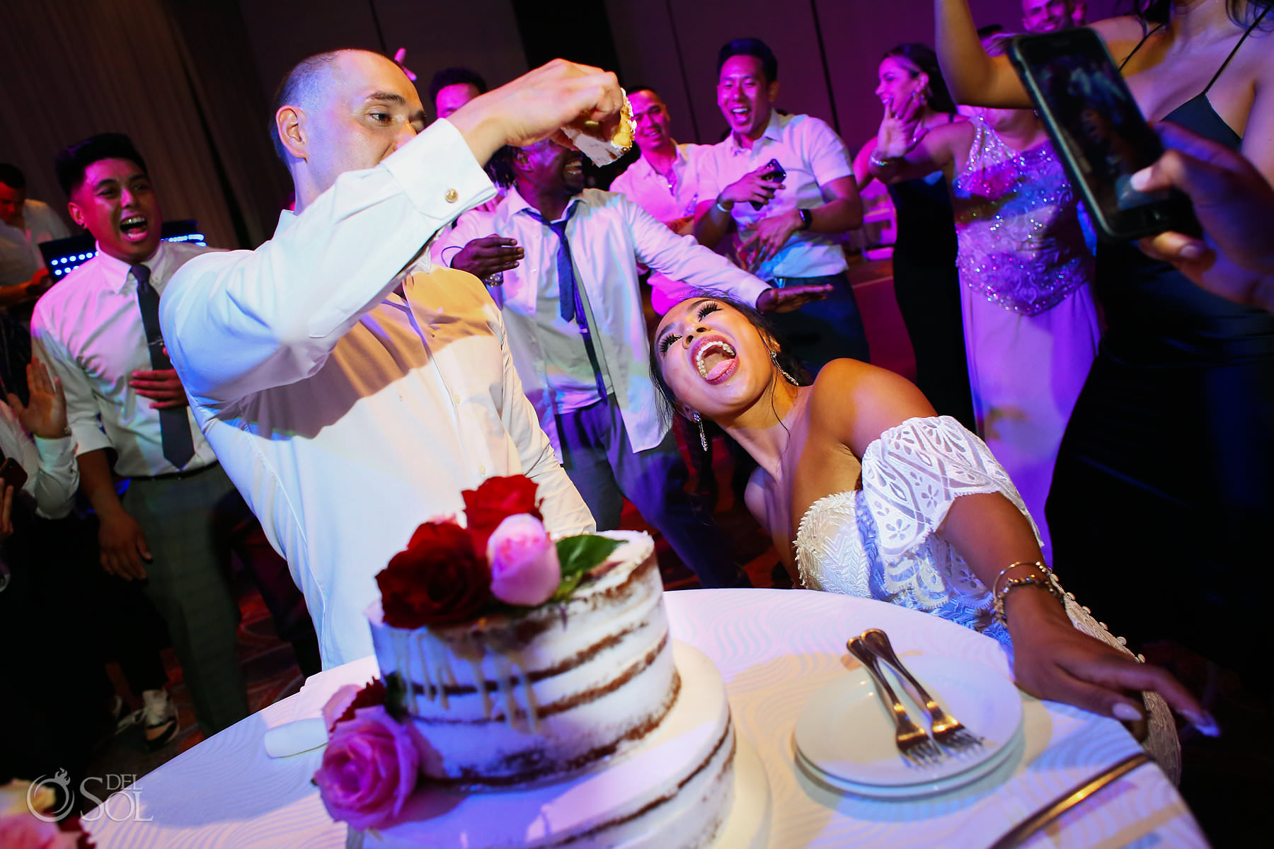 Secrets The Vine Cancun wedding cake cut fun