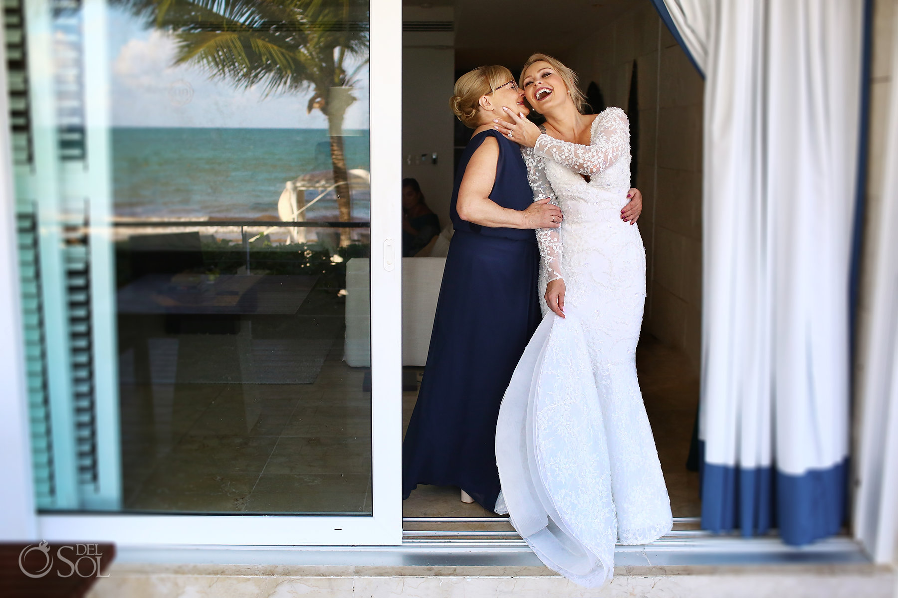 best candid wedding photos bride hugs mom blue diamond luxury boutique hotel