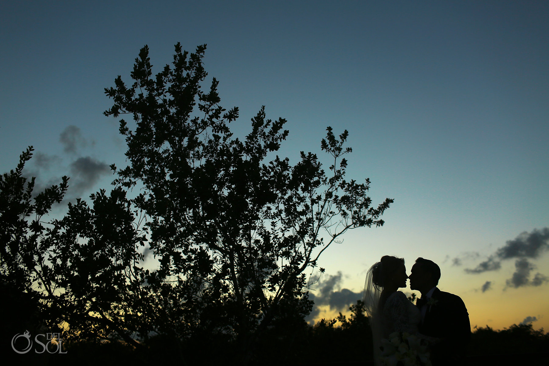 sunset silhouette destination wedding bride and groom portrait blue diamond luxury boutique hotel