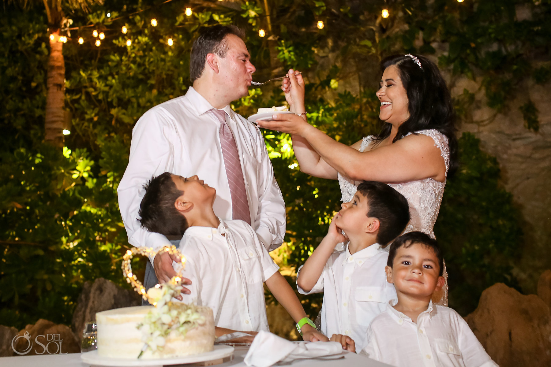 Including your kids on your wedding day cake cutting Hotel Xcaret mexico