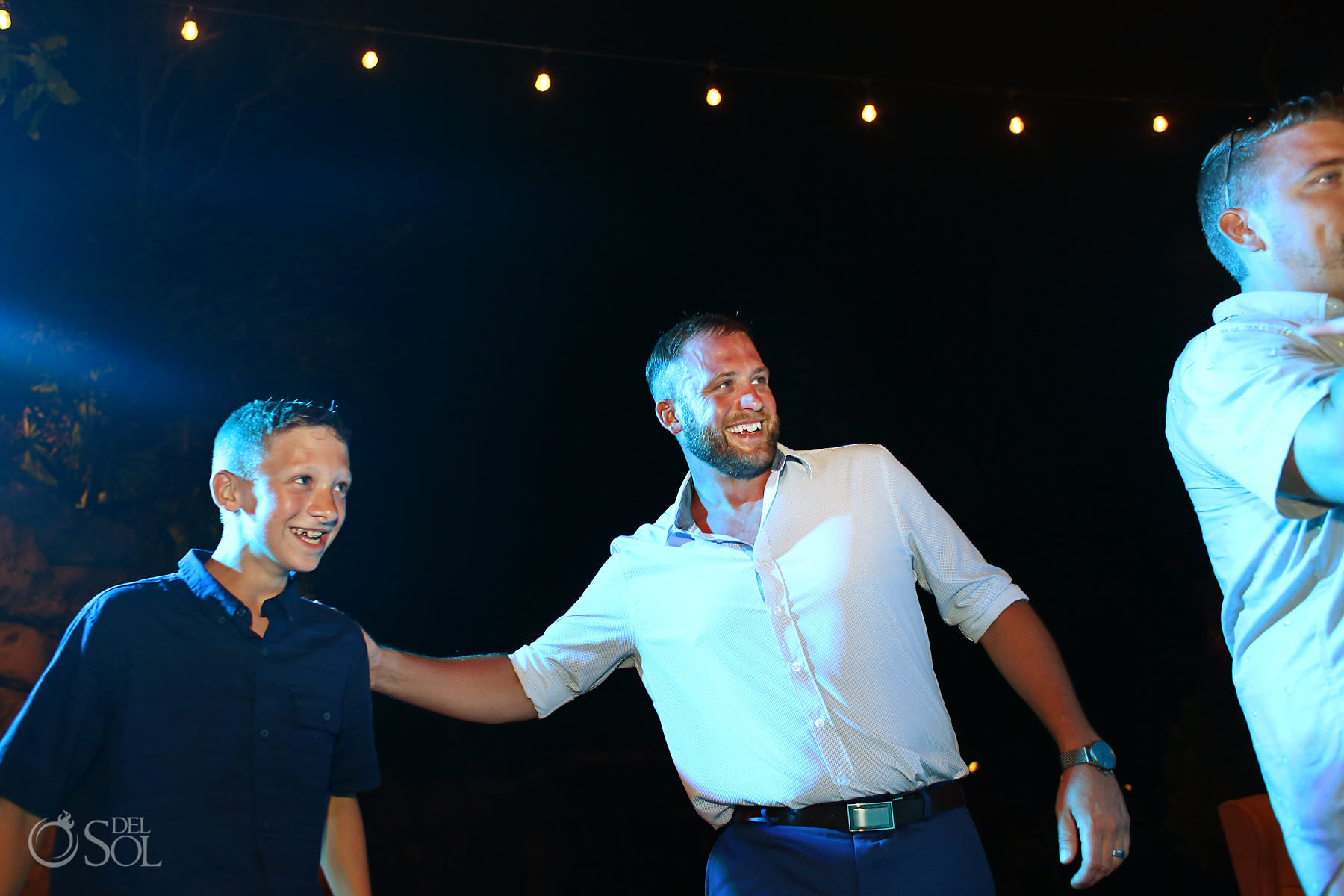 groom and son dancing at wedding reception Hotel Xcaret mexico