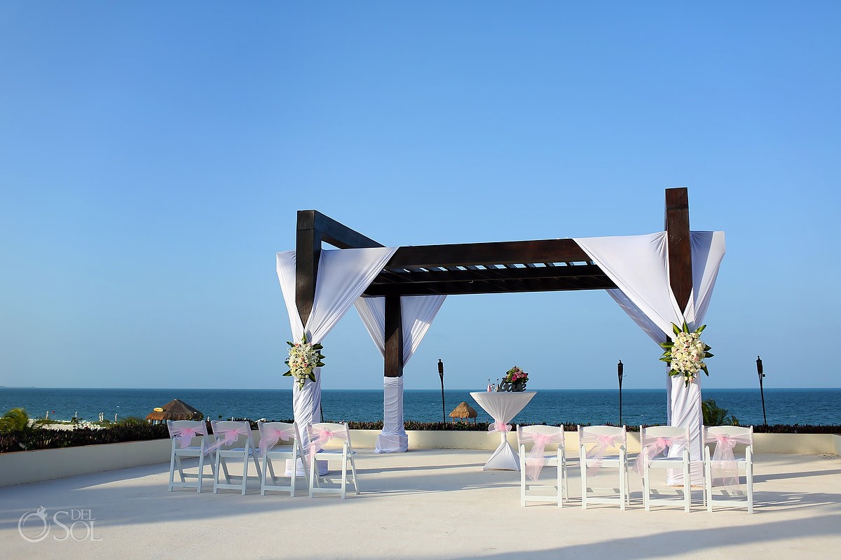 Secrets Playa Mujeres Weddings Infinity Terrace pergola ceremony setup
