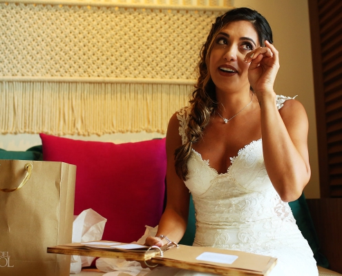 Emotional bride reading letters from her bride Mexico Same Sex Wedding