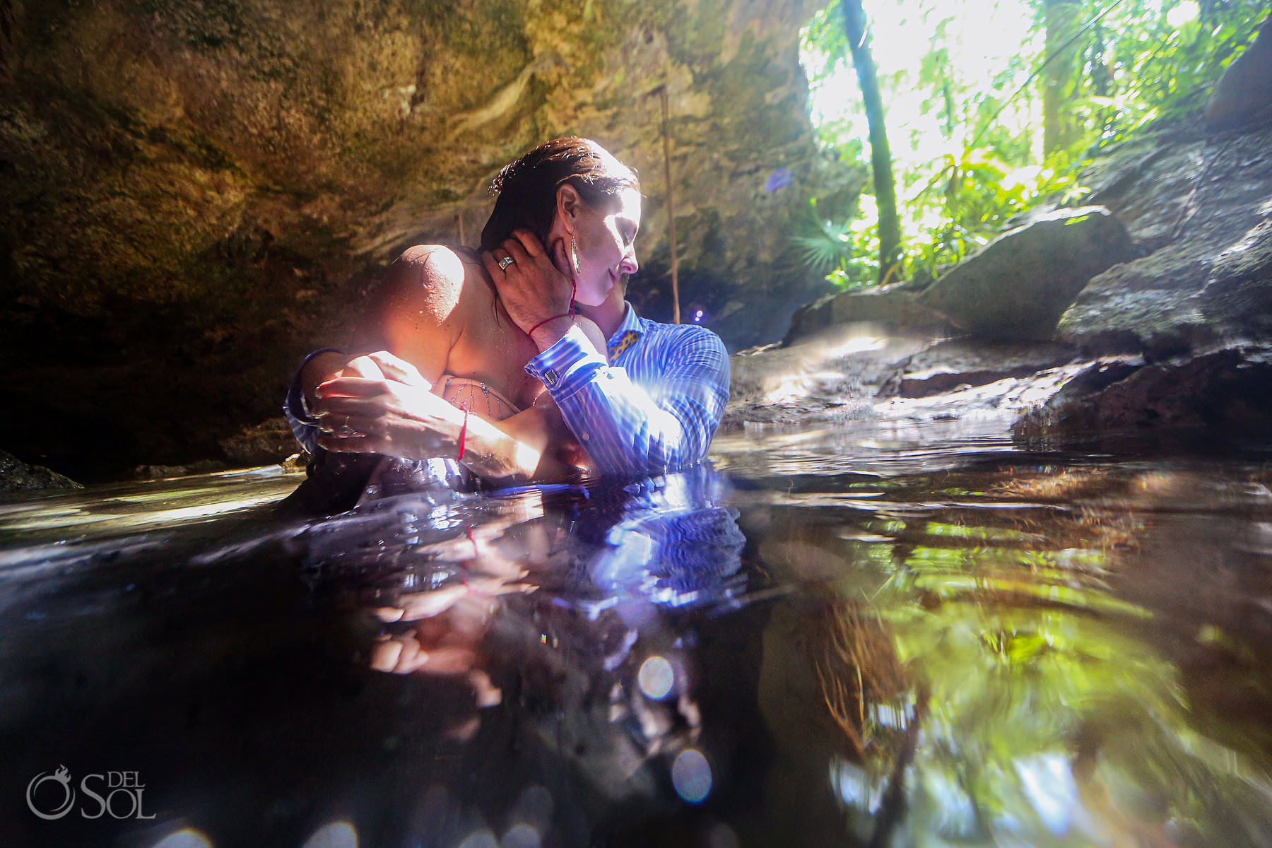 Bride getting kissed Eloping in cenotes in mexico