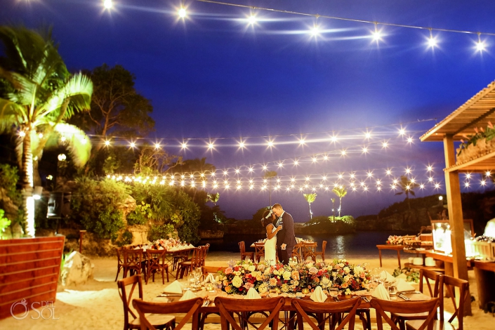 Hotel Xcaret Caleta Wedding reception setup romantic florals string lights
