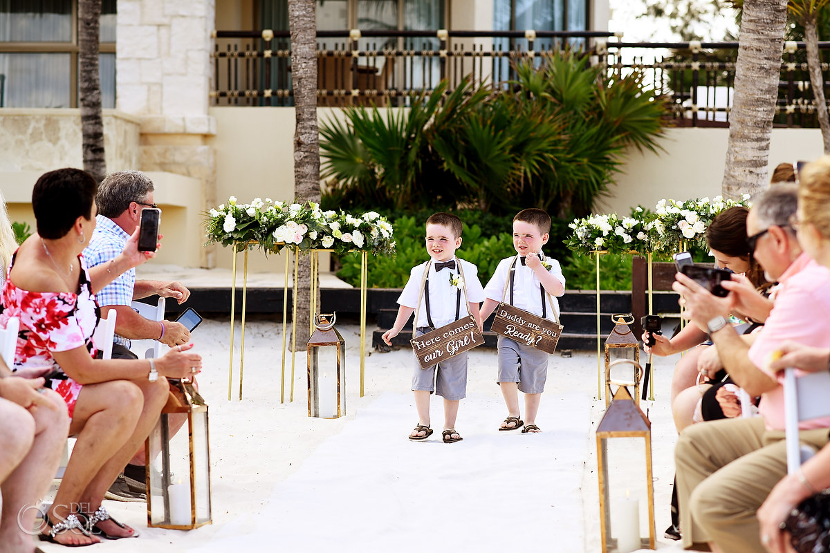 grooms sons ring bearers with custom wooden wedding signs