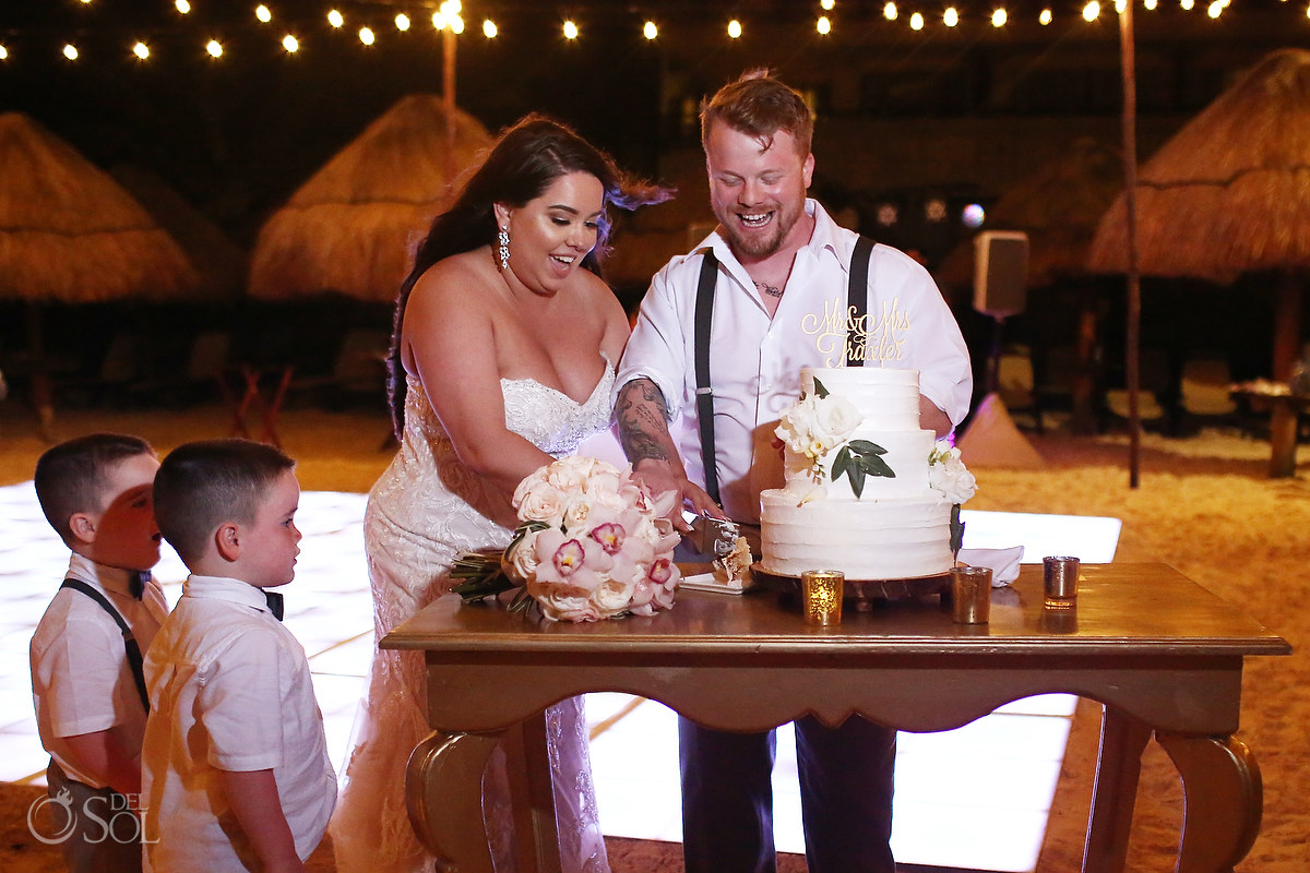 cake cutting Dreams Riviera Cancun Beach Wedding reception