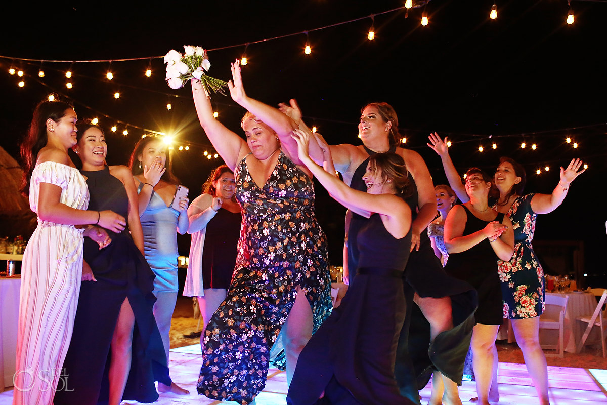 bouquet toss Dreams Riviera Cancun Beach Wedding reception