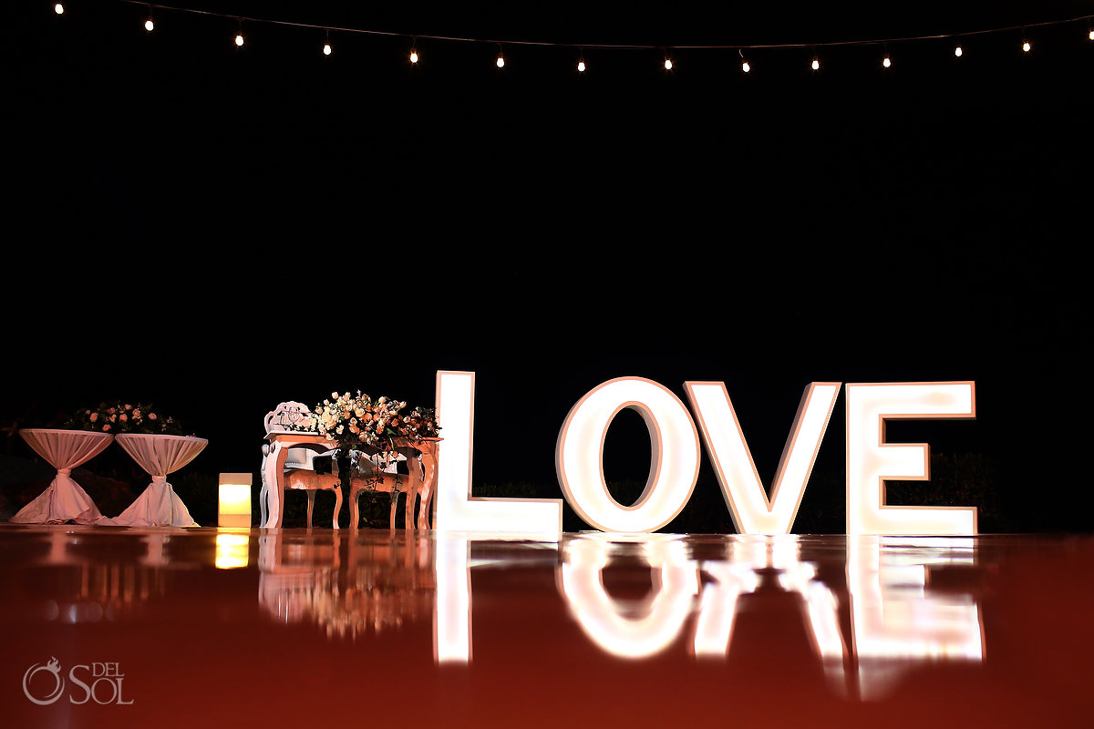 wedding reception setup with LOVE sign Ocean Terrace Hard Rock Riviera Maya