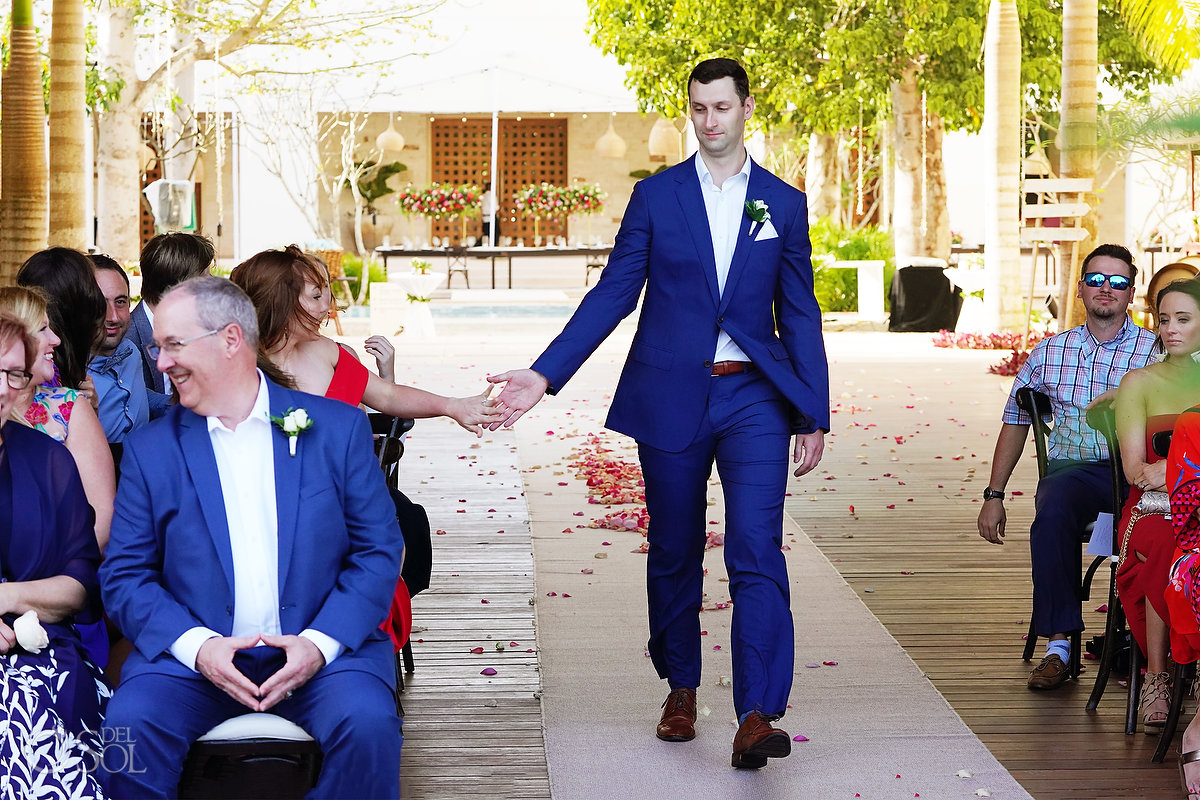 groom gives high five entering Arch ceremony Secrets akumal