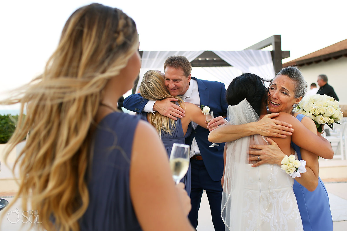 hugs after wedding ceremony Secrets Playa Mujeres