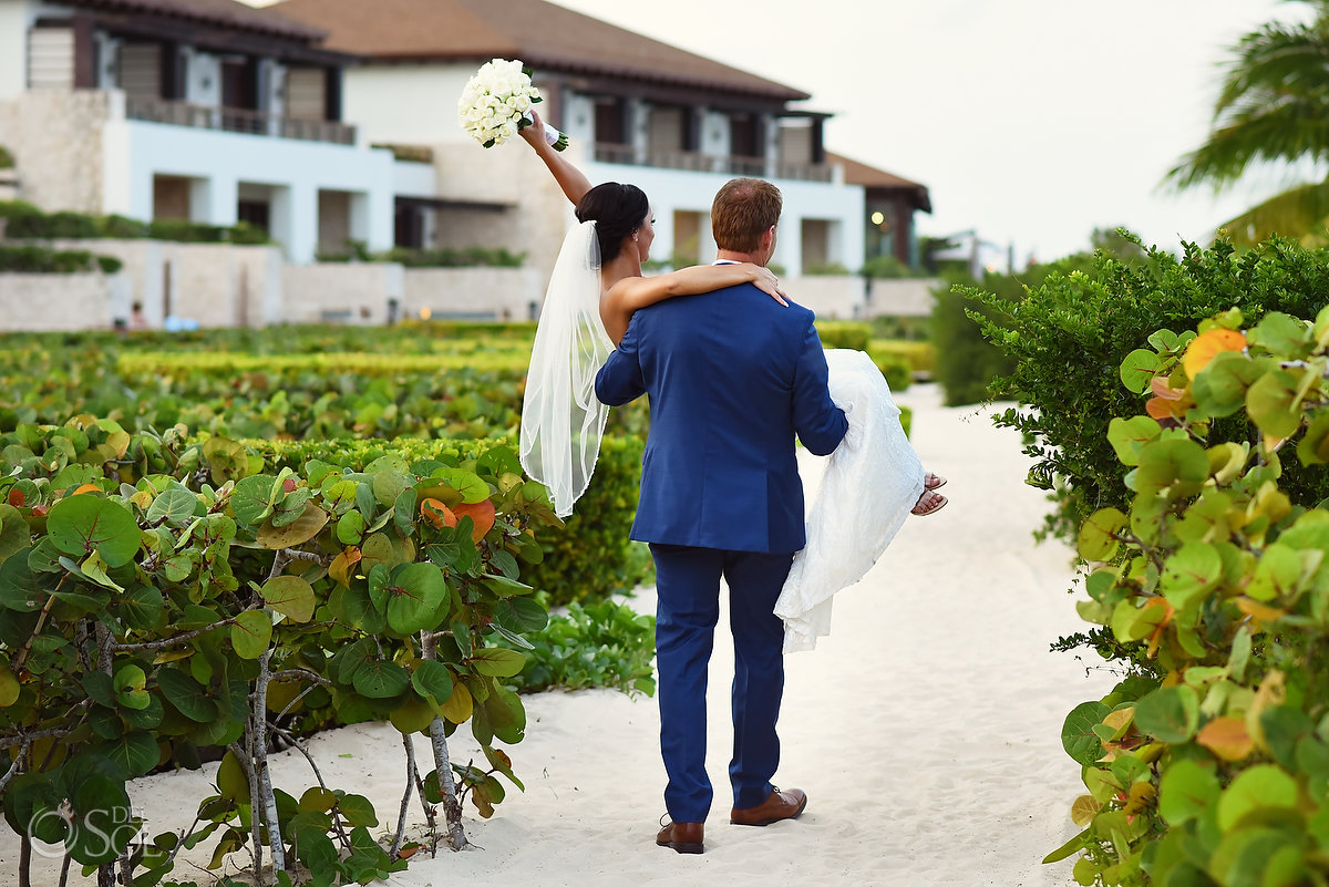 groom Carrying bride candid portrait