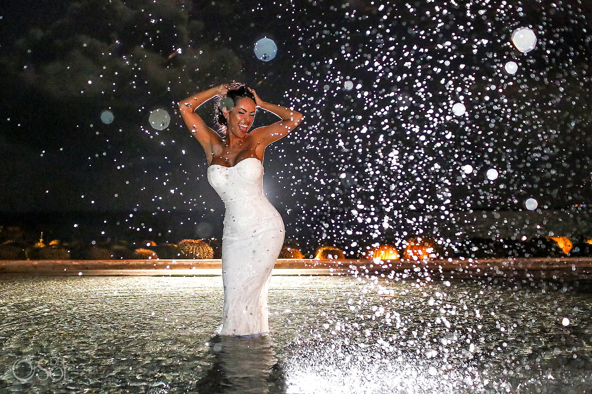 Fun bride portrait in the swimming pool Secrets Playa Mujeres