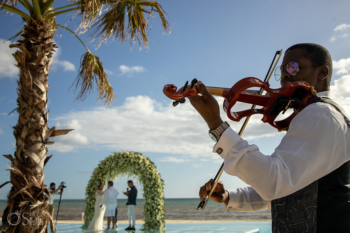 Violin player Dreams Natura Wedding Ceremony Infinity Pool Riviera Cancun Mexico