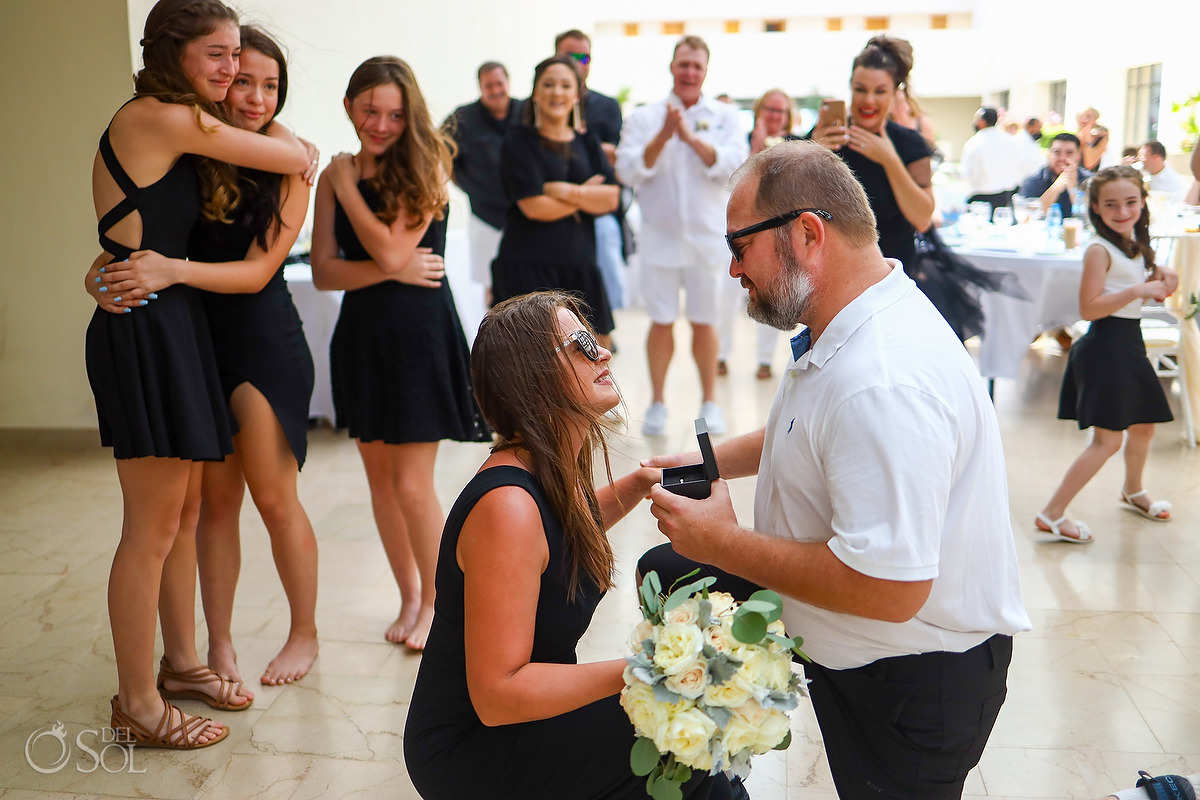 Surprise Proposal during wedding reception bouquet toss Dreams Natura Riviera Cancun Mexico