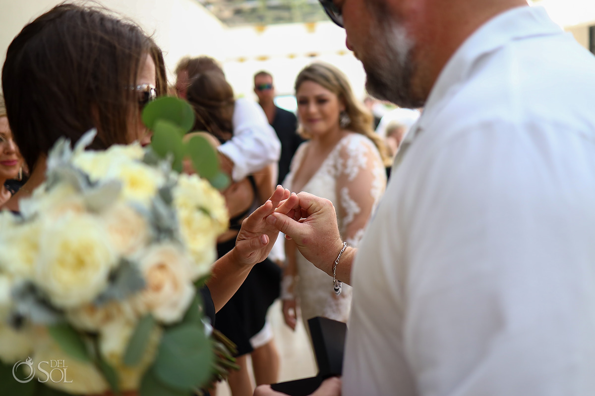 Surprise Proposal during wedding reception bouquet toss Dreams Natura Riviera Cancun Mexico