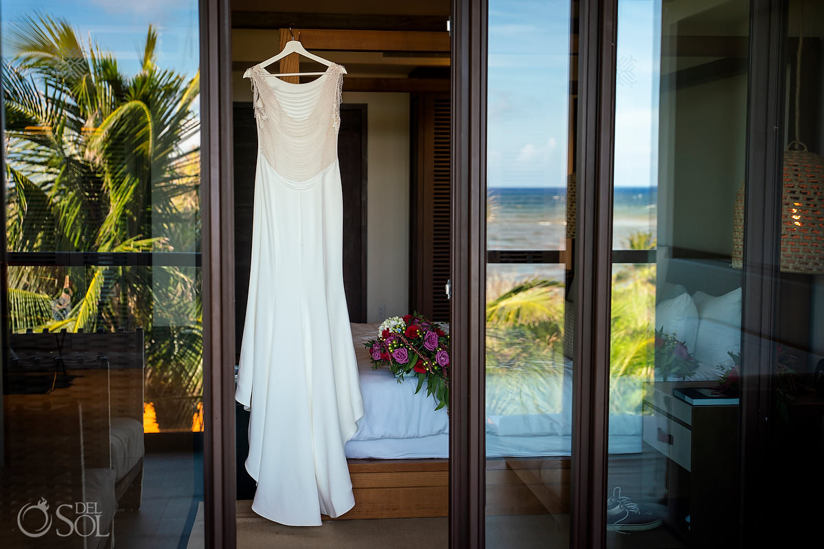 Rima lav wedding dress hanging in Unico Riviera maya suite balcony