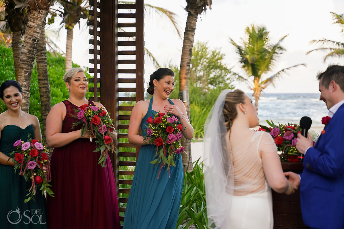 bridesmaids in mismatched wedding dresses teal, claret and green