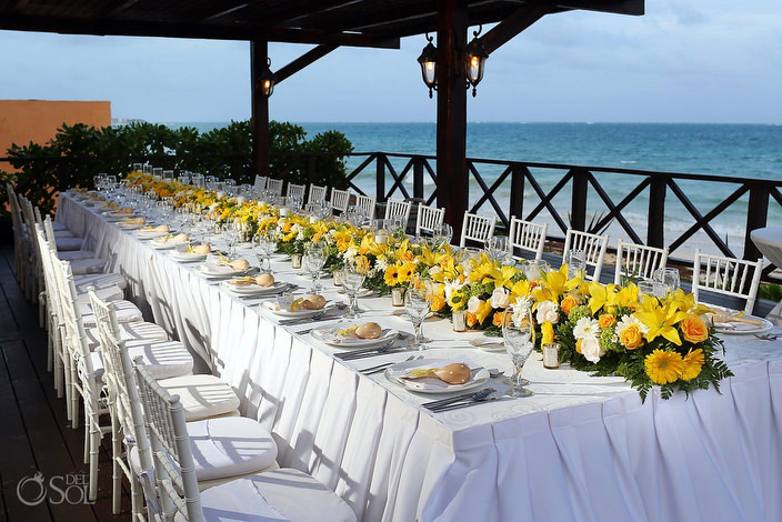 Dreams Sapphire plated dinner setup long table yellow flowers