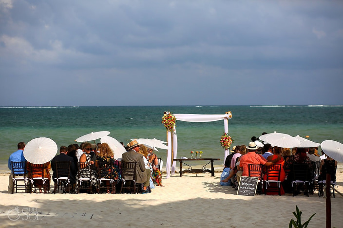 guests holding parasols dreams sapphire hidden beach
