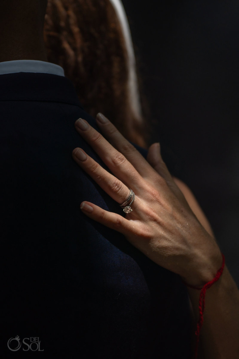 bride and groom posting wedding ring