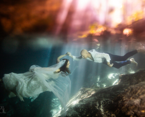 underwater bride and groom trash the dress Mexico cenote wedding ceremony