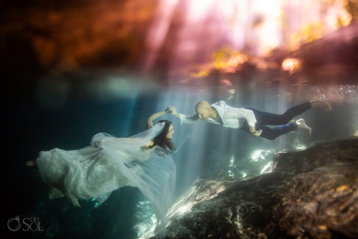underwater bride and groom trash the dress Mexico cenote wedding ceremony