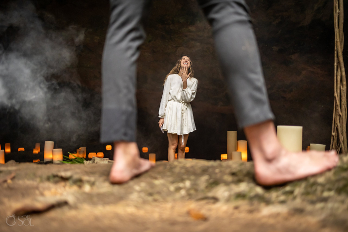 Guy surprises his girlfriend in Mexico with a romantic Tulum Cenote Proposal by del Sol Photography in the jungle underground
