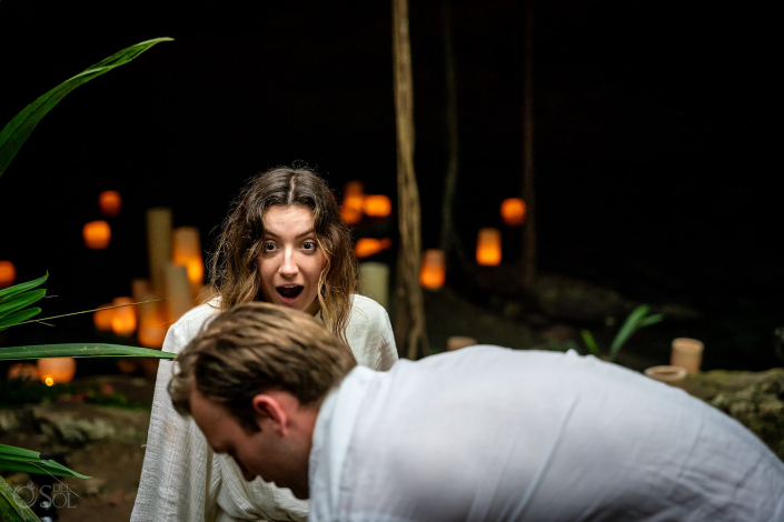 Guy surprises his girlfriend in Mexico with a romantic Tulum Cenote Proposal by del Sol Photography in the jungle underground.