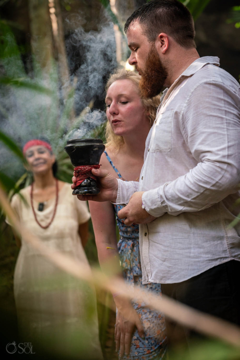 copal blessing ceremony in a cenote