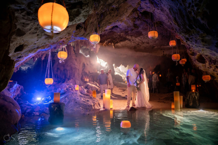 hanging and floating candles in a cenote wedding ceremony