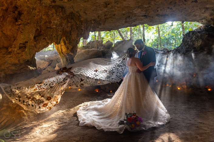 cave wedding with beams of light Family Cenote Ceremony in Mexico