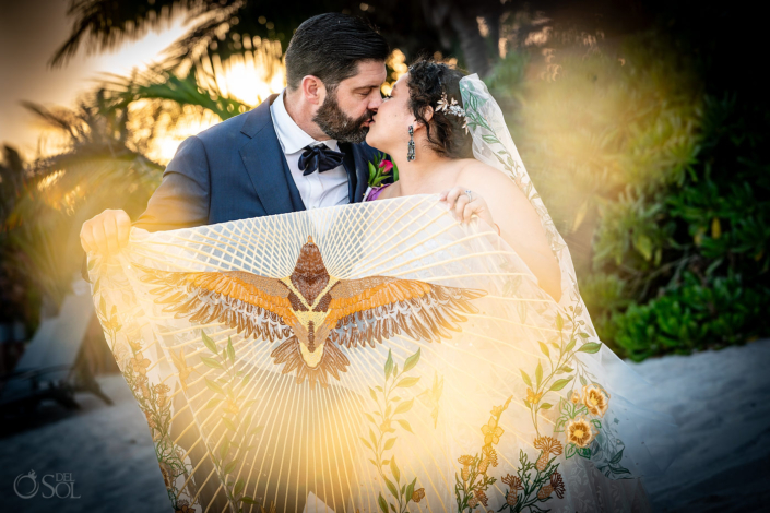 Bride and groom hacienda del mar puerto aventuras wedding with amazing handmade eagle veil