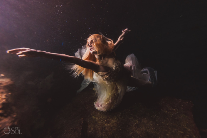 underwater bride portrait trash the dress wedding photography Tulum Jungle Cenote Mexico