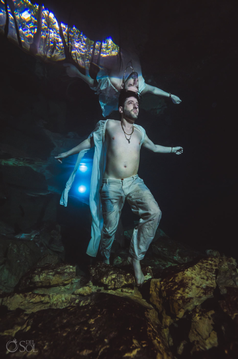 unique groom portrait underwater trash the dress wedding photography Tulum Jungle Cenote